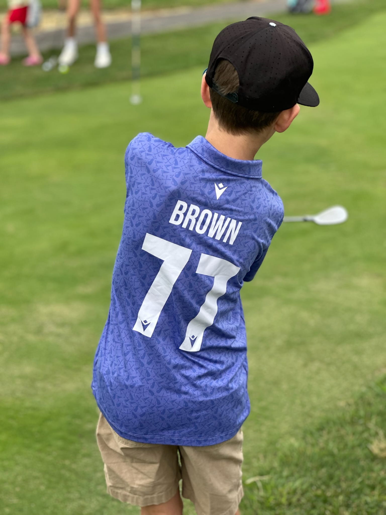 The founder, mid-swing. Golfers deserve good gloves too, apparently.